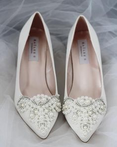 white wedding shoes with pearls and crystals on them