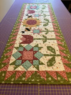 a quilted table runner on a cutting board