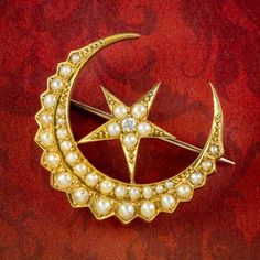 A beautiful antique Victorian celestial brooch depicting a crescent moon and star. It's fashioned in 18ct gold and lined with glowing, natural seed pearls, simulating moonlight and a twinkling old mine cut diamond in the centre to give the star its sparkle. Celestial jewellery became increasingly sought after during the 19th Century as people began to look up at the stars and heavens once more with renewed fascination. The crescent moon was a symbol of the Greek God Selene, the feminine moon God Victorian Celestial, Celestial Brooch, Moon God, Crescent Moon And Star, Star Brooch, Old Mine Cut Diamond, Greek God, Female Empowerment, Antique Pendant