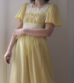 Vintage 70s Yellow cotton long dress. Cotton fabric with textured micro dots. Butterfly sleeves, ribbons to tie on the back, macramé cotton lace inserts. Tailored and not lined. Excellent vintage conditions. Bust 43 cm; 17 inch (x2) Waist 42 cm; 16.5 inch (x2) Hips 55 cm; 21.7 inch (x2) Lenght 145 cm; 57 inch Best fit size XS-S Model's size 8 uk h 163 cm. Cotton Maxi Dress With Empire Waist For Daywear, Vintage Dresses With Lace Patchwork For Daywear, Cotton Maxi Dress With Lace Trim For Daywear, Cotton Maxi Dress With Square Neck For Daywear, Cotton Maxi Dress With Broderie Anglaise For Daywear, Retro Cotton Vintage Dress For Daywear, Spring Cotton Maxi Dress With Lace Trim, Cotton Maxi Dress With Lace Trim, Retro Summer Vintage Dress With Lace Trim