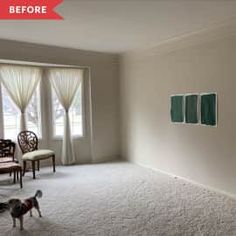 an empty living room with white carpet and two chairs on the far side of the room