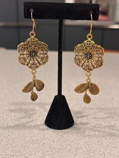 Traditional Indian Jhumka Earrings featuring intricate gold-plated detailing and a classic bell-shaped design. These earrings showcase filigree work and delicate hanging elements, embodying a timeless elegance perfect for weddings and festive occasions. Indian Jhumka, Jhumka Earrings, Wedding Jewelry Earrings, Jersey City, Traditional Indian, Floral Earrings, Wedding Earrings, Timeless Elegance, Wedding Jewelry