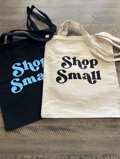 "This listing is for one \"Shop Small\" Tote Bag. These are approx. 12x12 inches and come in both tan and black. So cute and perfect for grocery shopping or carrying all of your items! Design can be done in any of the colors listed!" Shop Small Tote Bag, Black Reusable Shopping Bag, Black Casual Reusable Bag, Casual Black Reusable Bag, Reusable Black Bag For Everyday Use, Reusable Black Shoulder Bag For Shopping, Black Reusable Bag For Everyday Use, Black Tote Bag For Personal Use, Black Reusable Shoulder Bag For Shopping