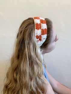 Adorable crochet headbands, perfect for unleashing your inner hippie. These headbands are handmade with colorful yarn, creating the best accessory for any occasion. Great for music festivals, farmer's markets, picnics, etc. - Orange and white checkered-print headband -Main portion is 12in long by 2.5in wide, with 22in long ties on each side. Made with 100% acrylic yarn. Cute Headband Crochet, Crochet Naruto Headband, Crochet Cotton Headband, Crochet Hippie Headband, Crochet Checkered Headband, 70s Crochet Headband, 70s Head Scarf Crochet, Headbands Crochet, Checkered Crochet