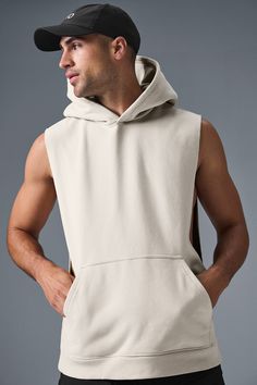 Stay cozy without sacrificing style in the Renown Sleeveless Hoodie. It has deep armholes, a kangaroo pocket, and a laid-back cut. And wait till you feel the Alo signature Renown fabric—it's smooth on the outside, a little fleecy on the side, and heavyweight for a just-right drape. Add shorts and you’re covered from the gym to the street. Casual Sleeveless Hoodie For Workout, Fall Gym Tops With Pockets, Sleeveless Alo Yoga Athleisure Top, Alo Yoga Sleeveless Athleisure Top, Alo Yoga Sporty Sleeveless Top, Cotton Hooded Activewear With Pockets, Cotton Hoodie Activewear With Pockets, Cotton Activewear Hoodie With Pockets, Sleeveless Hoodie With Drawstring For Spring