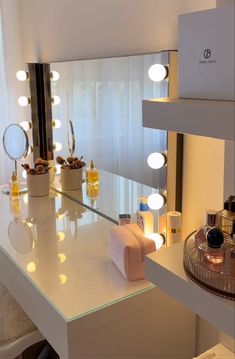 a vanity with lights and bottles on it