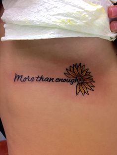 a woman's stomach with the words, more than enough written on her side