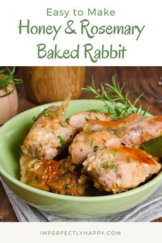 honey and rosemary baked rabbit in a green bowl on a wooden table with text overlay that reads easy to make honey and rosemary baked rabbit