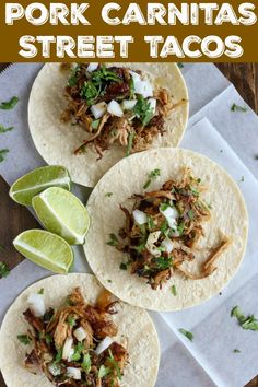 pork carnitas street tacos with limes and cilantro on the side