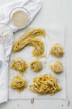 the ingredients for homemade pasta laid out on a table