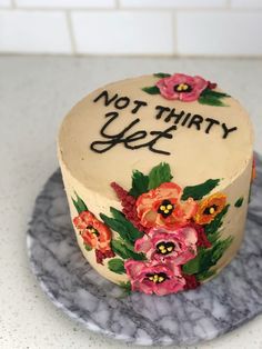 there is a cake with flowers on it that says not that y'ests