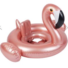 an inflatable flamingo float is shown on a white background, it has a black beak and orange eyes