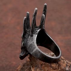 Introducing our Vintage Black Helm of Sauron Stainless Steel Ring, a striking homage to the iconic imagery of Middle-earth. Crafted with meticulous attention to detail, this ring captures the ominous allure of the Dark Lord's helm. Forged from high-quality stainless steel, this ring boasts both durability and elegance. Its vintage black finish adds an air of mystery and intrigue, while the intricate design of the helm of Sauron commands attention. Whether worn as a bold statement piece or as a s Nautical Candle Holders, Cocktail Design, Beach Backpack, Sea Turtle Bracelet, Fish Hook Bracelet, Fish Hook Necklace, Whale Necklace, Fishing Bracelet, Shark Necklace