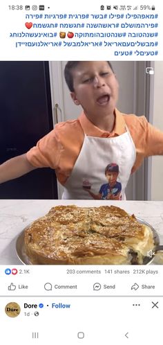 a young boy in an apron is making a funny face