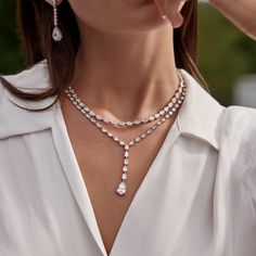 Designers Badgley Mischka believe that every woman should look and feel glamorous, and we agree! This drop shaped necklace is designed keeping that belief in mind. Pear cut lab grown diamonds are set beautifully in this necklace with a double clasp for extra security. Pear Shaped Diamond Necklace, Bali Wedding, Tennis Necklace, Pear Shaped Diamond, Badgley Mischka, Pear Cut, Every Woman, Lab Grown, Lab Grown Diamonds