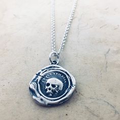 This wax seal pendant features a detailed skull surrounded by the Latin phrase "Es Fui, Sum Eris" which translates to " So as you are, So once was I". We make this pendant using a salvaged wax seal from an antiquarian document that sat in a private collection for over 80 years and dates to the late 1700's, early 1800's. Such an amazing piece of history!Let this wax seal charm be your daily reminder and inspiration to live life well. Details ►Size: charm measures 3/4" x 5/8" ►Materials: Sterling Chain Length Chart, Latin Mottos, Wax Seal Pendant, Wax Seal Necklace, Latin Phrases, Material Things, Inspo Board, Character Inspo, Skull Pendant