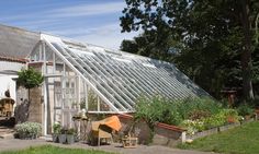 an old greenhouse is being used as a house