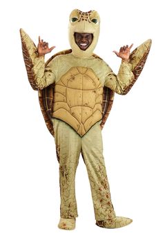 a man in a turtle costume standing with his arms outstretched and hands out to the side