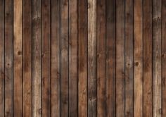 a wood paneled wall that is brown and has vertical planks on the sides