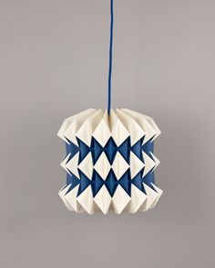 a white and blue origami hanging decoration