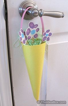 an umbrella shaped planter is hanging on the door