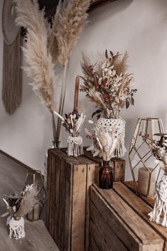 an arrangement of dried flowers and other decorative items