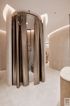 the interior of a modern bathroom with large curtains