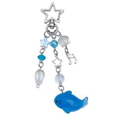 a key chain with a blue fish and star charm on it's end, hanging from a metal hook