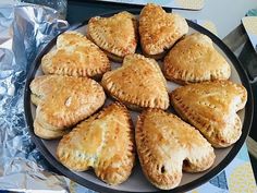 a plate full of pastries sitting on top of a table