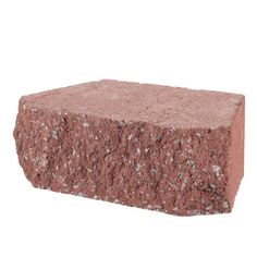 a block of red rock sitting on top of a white background