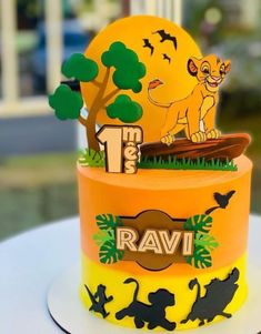 a lion themed birthday cake on a table