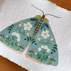 a paper with a butterfly painted on it