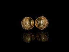 Two Genuine 22 karat Gold Vermeil wire work beads in a traditional Balinese design. Width is 14mm. Hole to hole is 12mm. Hole size is 3-3.5mm. Weight is 6.95 grams. Check out our other Gold Vermeil beads: https://www.etsy.com/shop/KartiniStudio?section_id=16821428&ref=shopsection_leftnav_5 Check out our Sterling Silver beads: https://www.etsy.com/shop/KartiniStudio?section_id=16820809&ref=shopsection_leftnav_6 Gold Earrings With Spacer And Round Beads, Antique Gold Polished Beads, Antique Polished Gold Beads, Gold Oval Beads For Wedding, Antique Large Gold Beads, Traditional Earrings With Gold Round Beads, Gold Earrings With Polished Round Beads, Gold Earrings With Large Beads As Gift, Gold Earrings With Large Beads For Gift