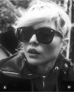 black and white photograph of woman wearing sunglasses