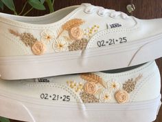 Made to order hand embroidered Vans.  Embroider your wedding bouquet on Vans on your special day! (Please send in photos of your wedding bouquet arrangement or inspiration.) PLEASE LEAVE A NOTE OF YOUR SHOE SIZE and YOUR CHOICE OF SHOE COLOR in 'add your personalization' section.  Current processing time is 8-9 weeks.  Wedding bouquet pattern will be hand embroidered with DMC cotton floss. Wedding date will be hand embroidered with polyester floss with metallic shimmer. The polyester floss is a bit rougher than cotton floss, therefore, it can be irritating on your feet without socks.  Although it is high quality fade-resistant thread, only spot clean is recommended. All care should be taken when wearing or cleaning the shoes.   Due to the nature of hand embroidery work, the work on each si Wedding Shoe Embroidery, Embroidered Wedding Sneakers, Custom Vans Wedding Shoes, Embroidered Vans Wedding, White Wedding Sneakers With Custom Embroidery, Bridal Vans, Wedding Bouquet Arrangements, Sneakers Wedding, Embroidered Vans