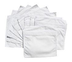 five pairs of white pants sitting next to each other on top of a white background