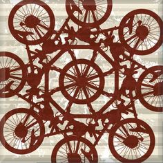 an image of bicycles in the middle of a pattern on a sheet of paper with words written below it