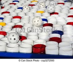 many white cups with red, yellow and blue lids