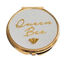 a compact mirror with the words queen bee on it