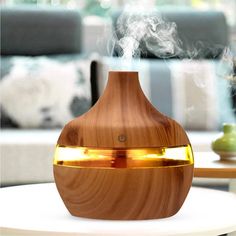 Aroma Essential Oil Diffuser LED Aroma Aromatherapy Humidifier Feature: 100% new and USB Mini humidifie Size: Approx.100X100X115mm Package weight: 205g AC Apaptor: 5V Rated Power:3 watt Water Capacity: 300ml Before power on, make sure there is enough water in, this product can not be in the case of no water Spray part can not be placed in water or rinse it under the tap, please wipe clean with a damp cloth or wet sponge Add water shall not the water line, so as not to overflow, must ensure that Large Room Humidifier, Room Humidifier, Aromatherapy Humidifier, Room Diffuser, Aroma Essential Oil, Cool Mist Humidifier, Aroma Oil, Air Humidifier, Aromatherapy Diffusers