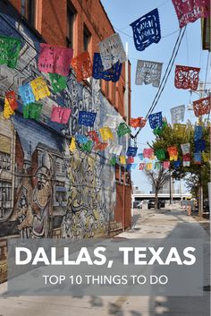 the side of a building with colorful flags hanging from it's sides and words that read, dallas, texas top 10 things to do