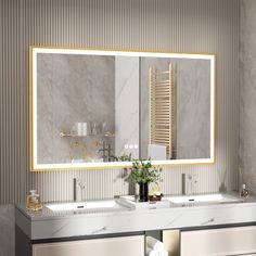 a bathroom with two sinks and a large mirror over it's sink area,