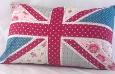 the union jack pillow is made from old fabric and has polka dot dots on it