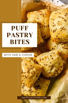 puff pastry bites with ham and cheese on parchment paper in front of a brown background