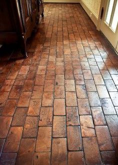 a kitchen floor that has been cleaned and stained