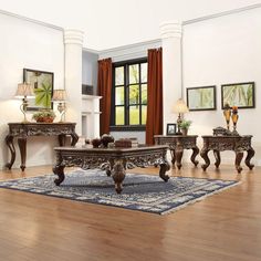 a living room filled with furniture on top of a hard wood floor covered in rugs