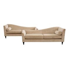 a pair of beige couches sitting next to each other on top of a white background