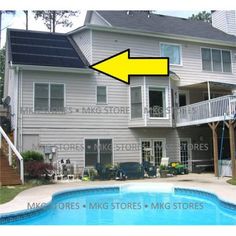 a large house with a yellow arrow pointing to the front door and above it is a swimming pool