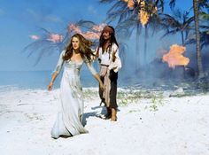 pirates of the carriben movie poster with two women in white dresses holding hands