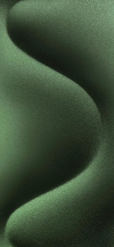 an abstract green background with smooth lines and curves in the center, as if it were fabric or silk